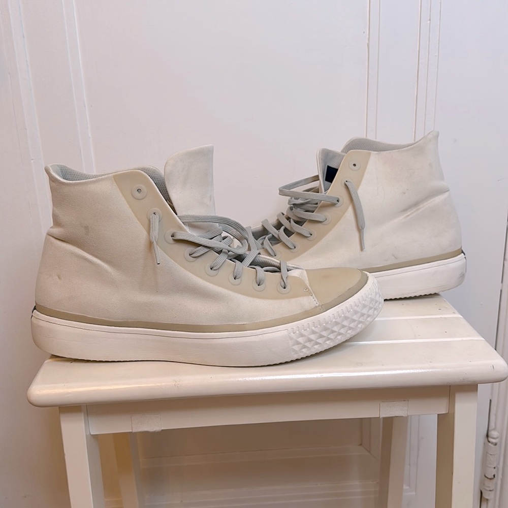 shoes feature minimalist aesthetic with, premium materials and subtle branding.
